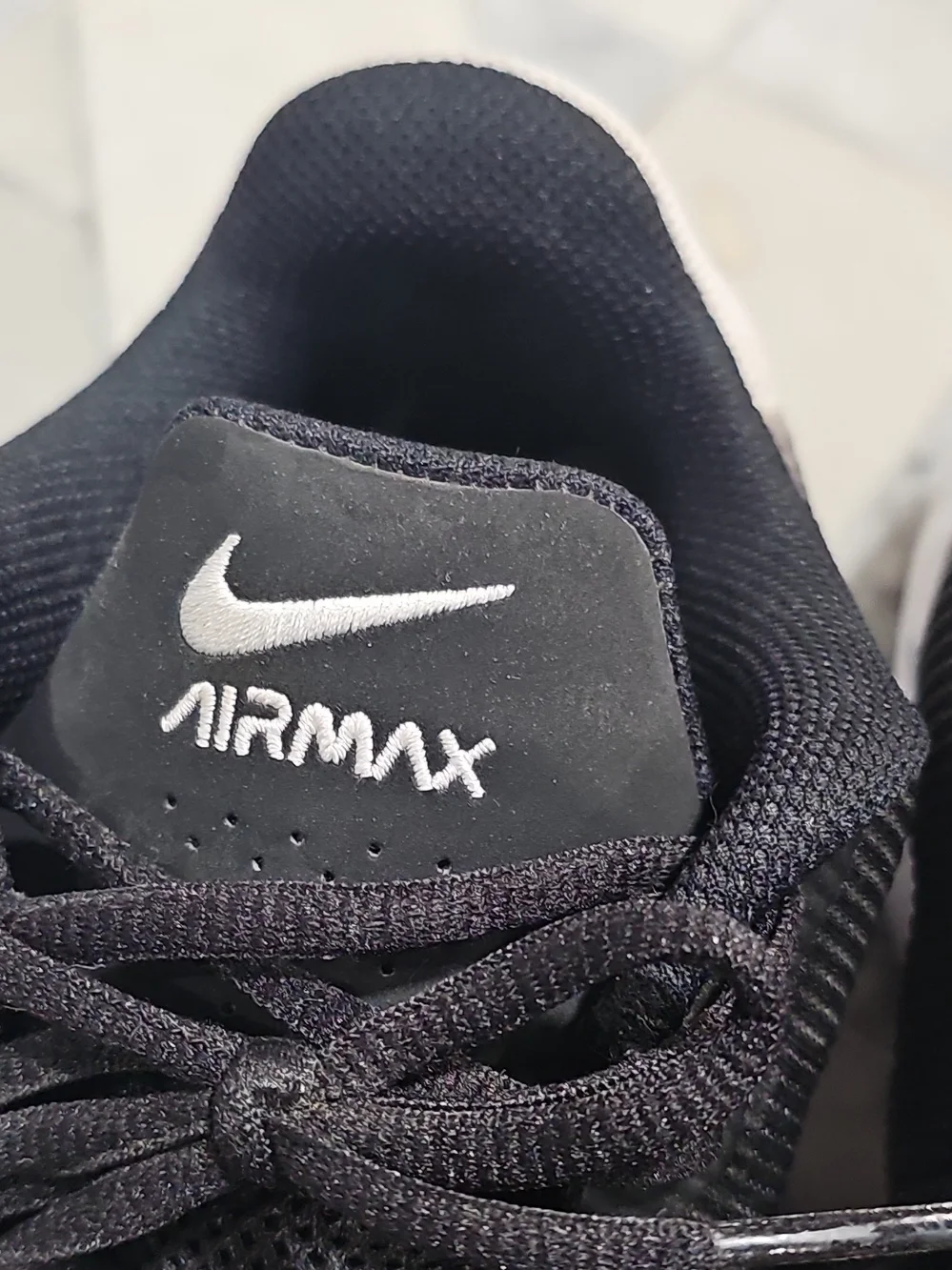 Nike AirMax Impact 4 Men’s Black and White Low-Top Athletic Sneakers
